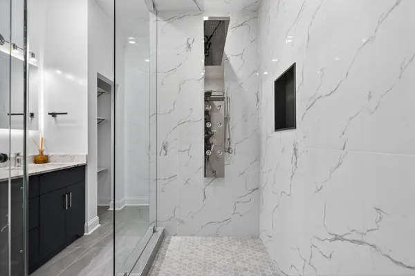a bathroom with a shower and toilet