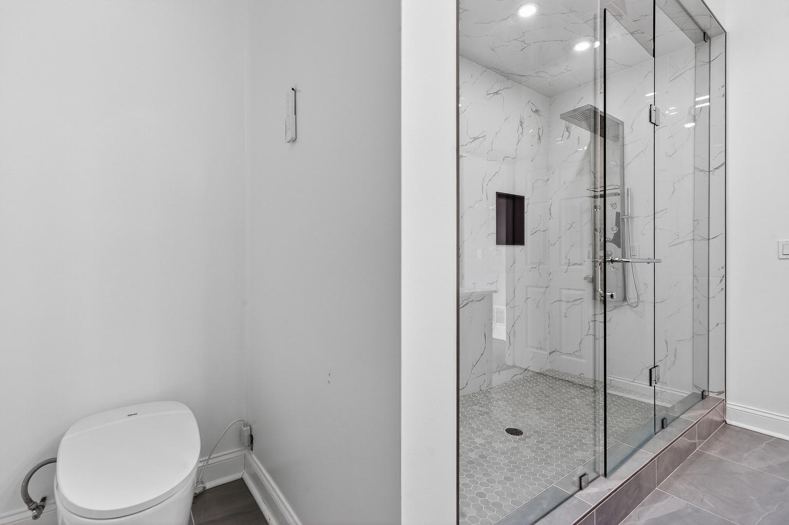 4646 South Prairie Avenue, Unit 2S Chicago, IL 60653 - Photo 14 of 32 a bathroom with a shower and toilet