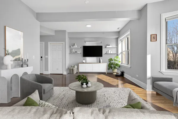 a bedroom with a bed and a potted plant on dresser