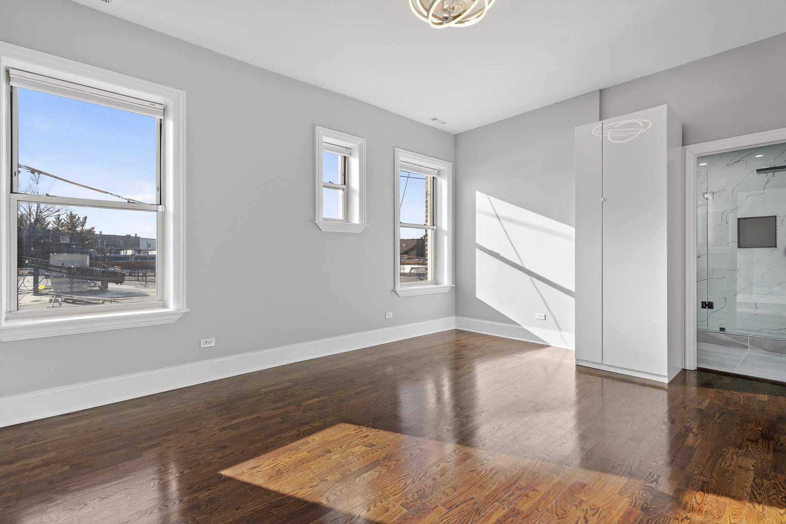 4646 South Prairie Avenue, Unit 2S Chicago, IL 60653 - Photo 10 of 32 a view of a livingroom with wooden floor and a window