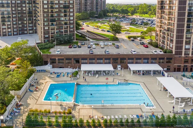 a view of swimming pool with outdoor seating
