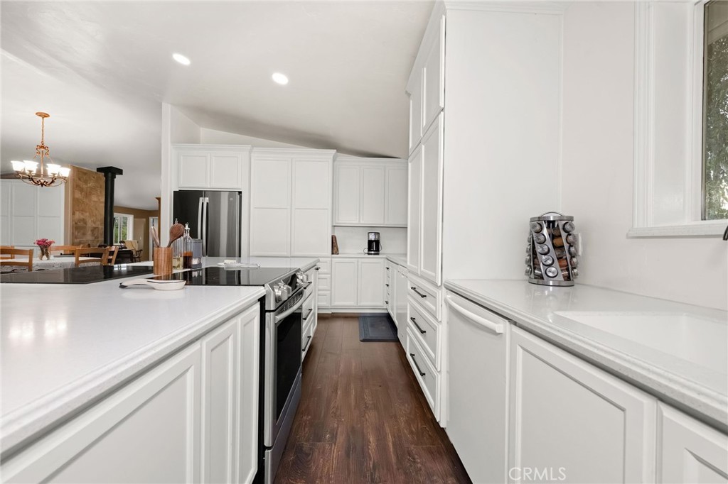 2728 Pentz Road Oroville, CA 95965 - Photo 7 of 52 a kitchen with a sink stove and cabinets