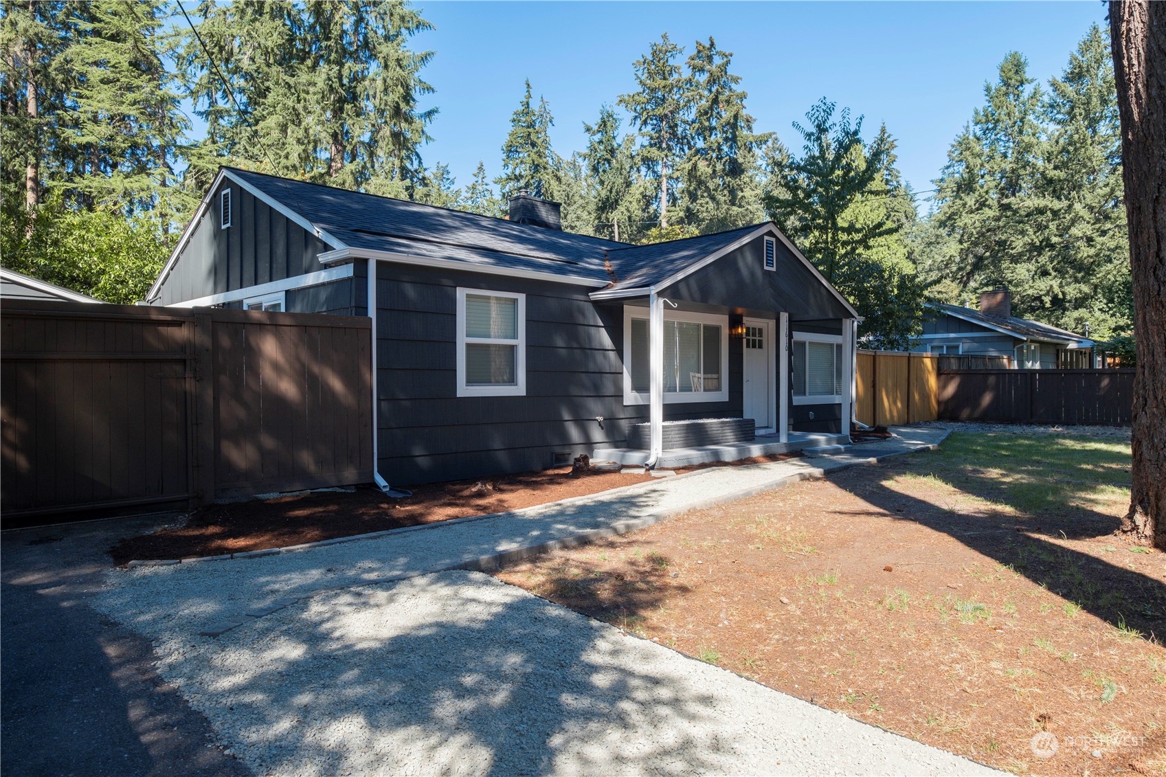 11610 Tower Road Southwest Lakewood, WA 98498 - Photo 1 of 35 a front view of a house with a yard