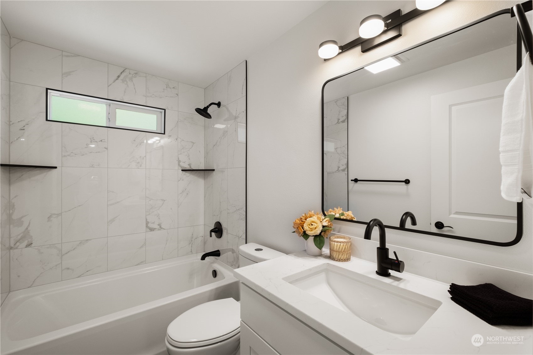 11610 Tower Road Southwest Lakewood, WA 98498 - Photo 15 of 35 a bathroom with a sink toilet tub and shower