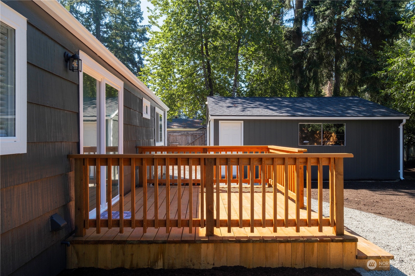 11610 Tower Road Southwest Lakewood, WA 98498 - Photo 25 of 35 a view of a house with a deck