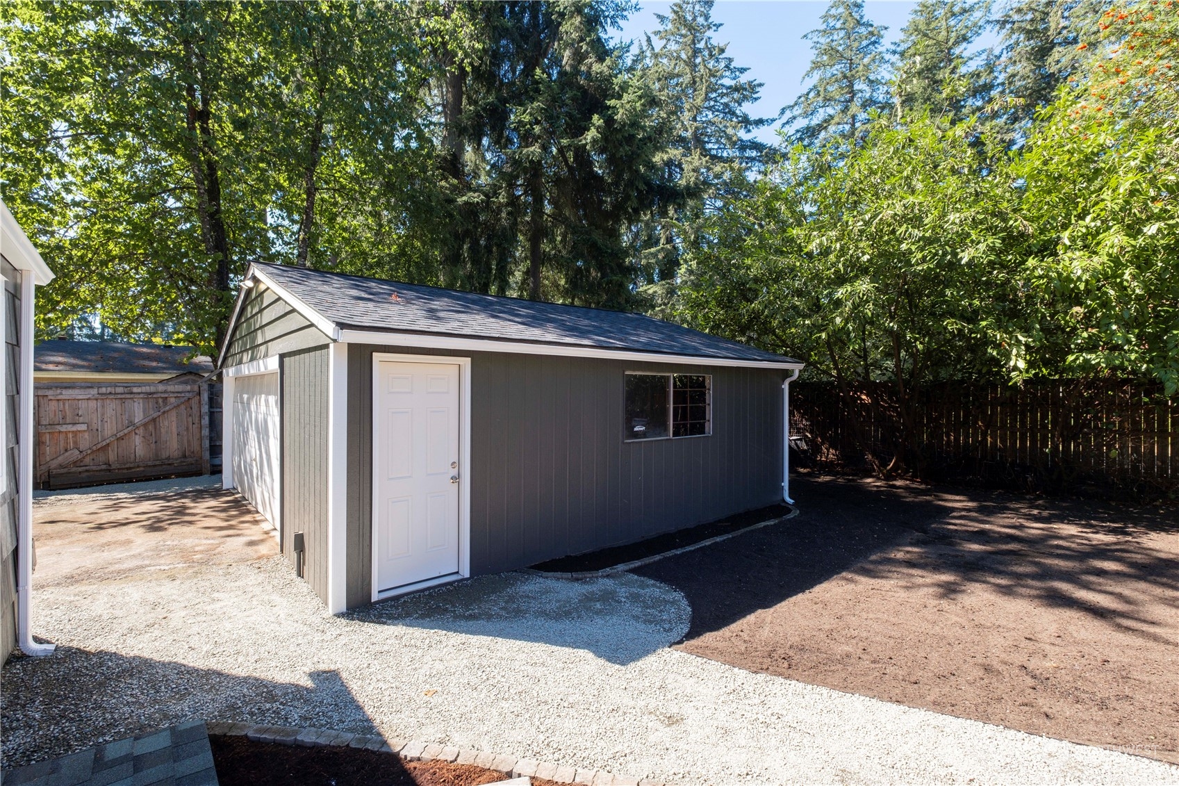 11610 Tower Road Southwest Lakewood, WA 98498 - Photo 28 of 35 a backyard of a house with lots of green space