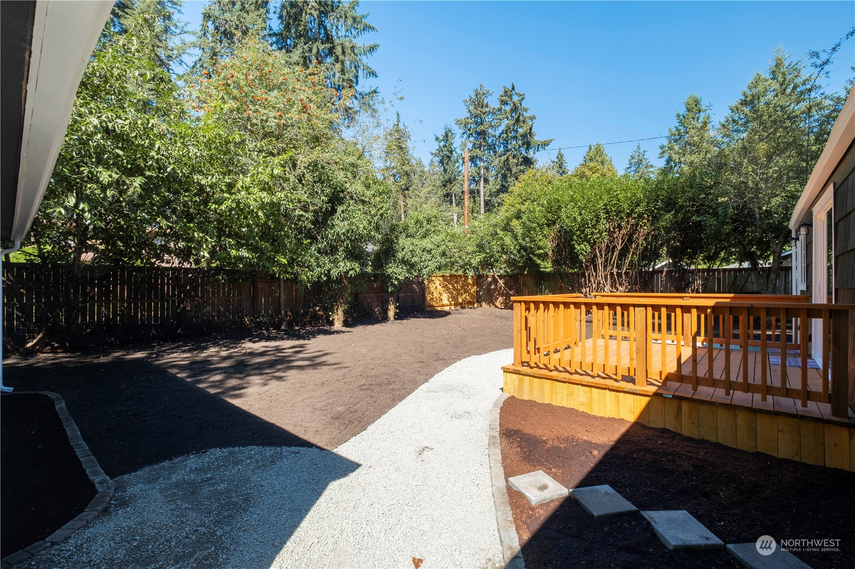 11610 Tower Road Southwest Lakewood, WA 98498 - Photo 29 of 35 a view of backyard with wooden fence and trees