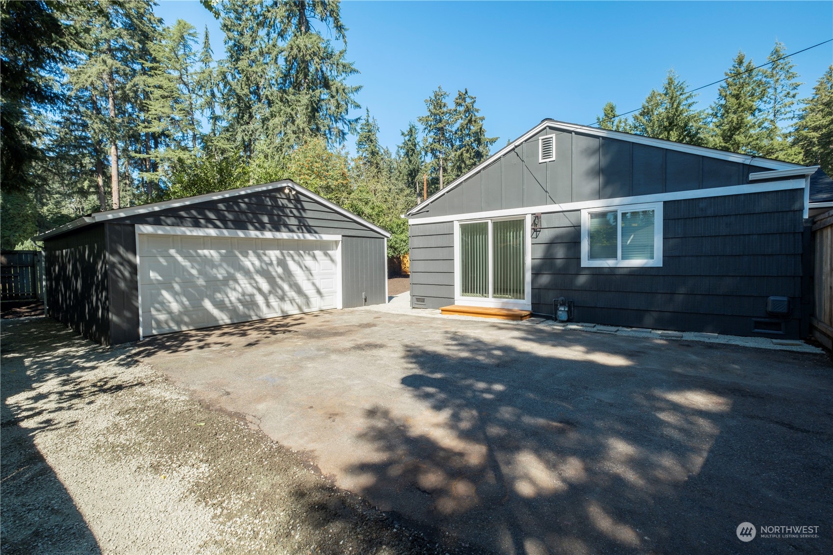 11610 Tower Road Southwest Lakewood, WA 98498 - Photo 31 of 35 a front view of a house with a yard and garage