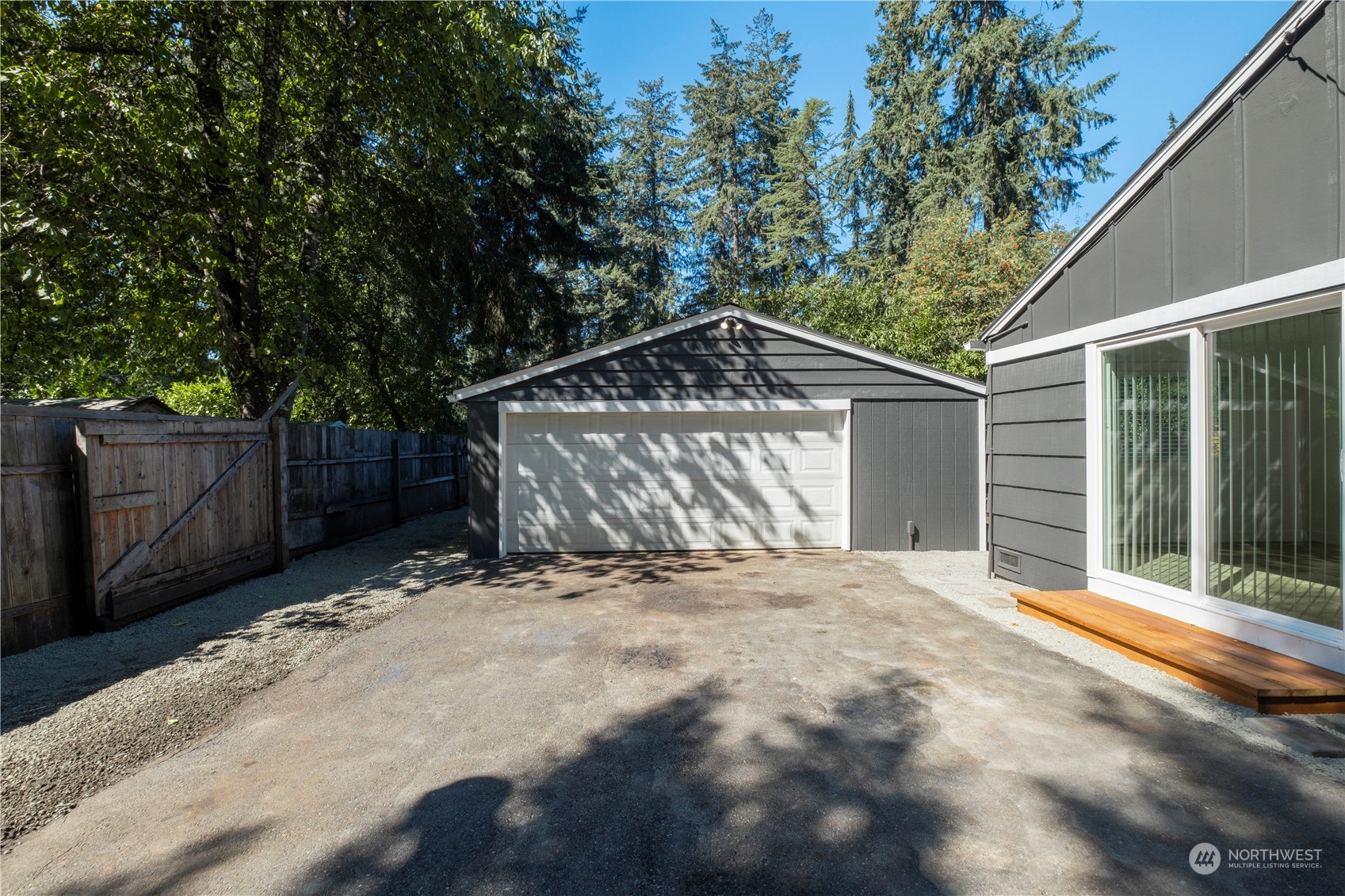 11610 Tower Road Southwest Lakewood, WA 98498 - Photo 32 of 35 a front view of a house with a yard and garage