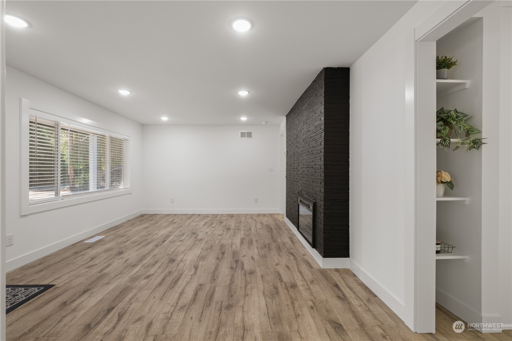 11610 Tower Road Southwest Lakewood, WA 98498 - Photo 6 of 35 wooden floor in an empty room with a window