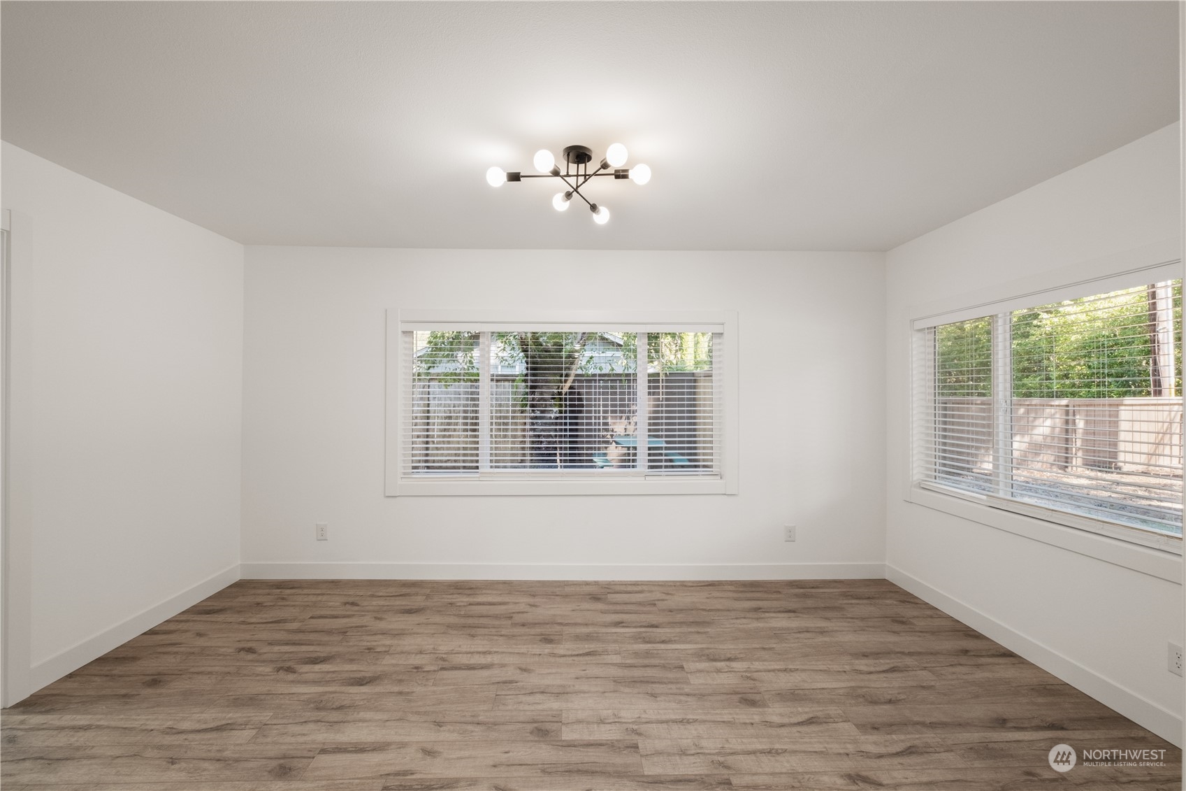 11610 Tower Road Southwest Lakewood, WA 98498 - Photo 8 of 35 a view of an empty room with a window