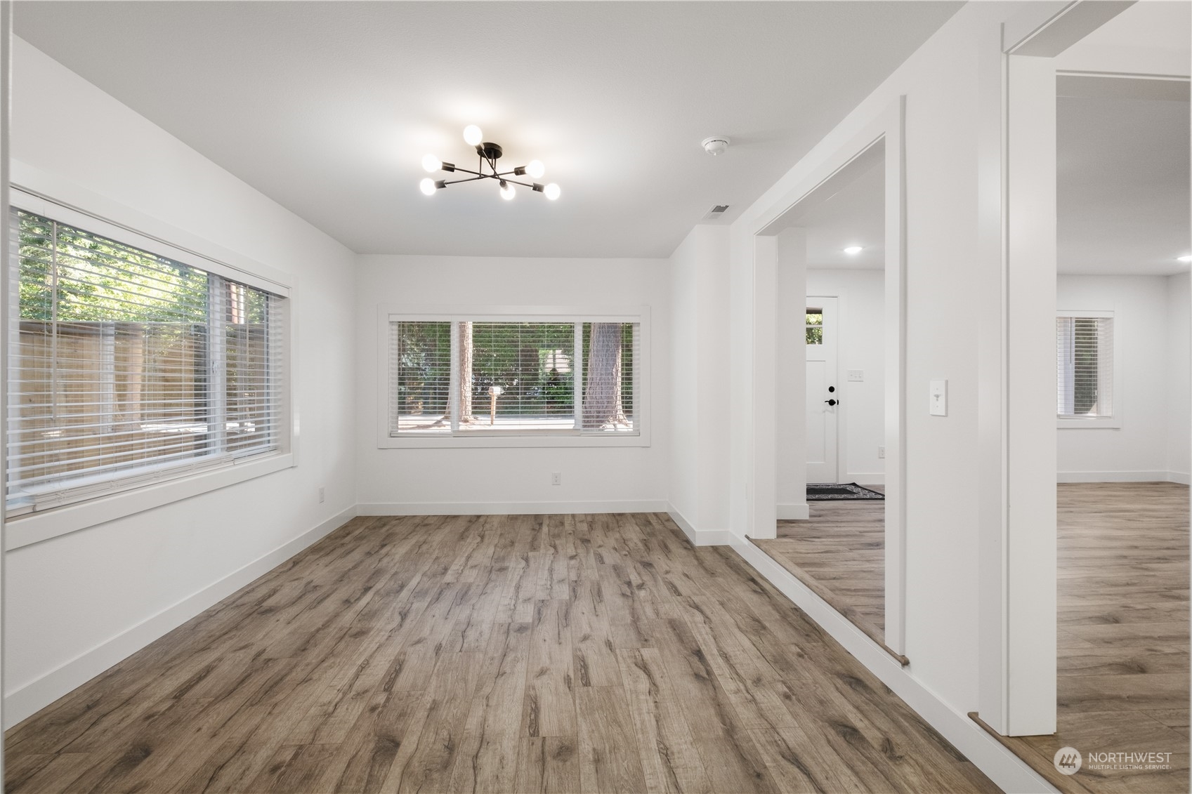 11610 Tower Road Southwest Lakewood, WA 98498 - Photo 9 of 35 wooden floor in an empty room with a window