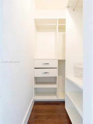 a kitchen with kitchen island a sink stainless steel appliances and cabinets
