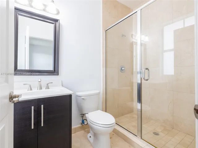 a kitchen with stainless steel appliances granite countertop a sink and a stove