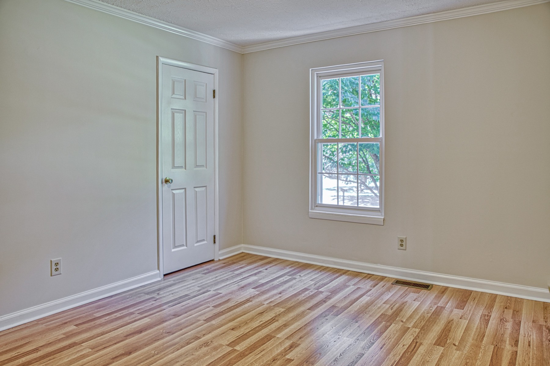 2085 Herbert Garrett Road Cookeville, TN 38506 - Photo 25 of 39 a view of an empty room with wooden floor and a window