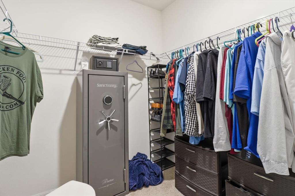660 Hickory Course Loop Ocala, FL 34472 - Photo 32 of 45 a view of walk in closet with clothes and shoes