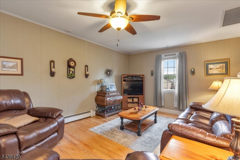 79 Main Street Califon, NJ 07830 - Photo 18 of 50 a living room with furniture and a flat screen tv