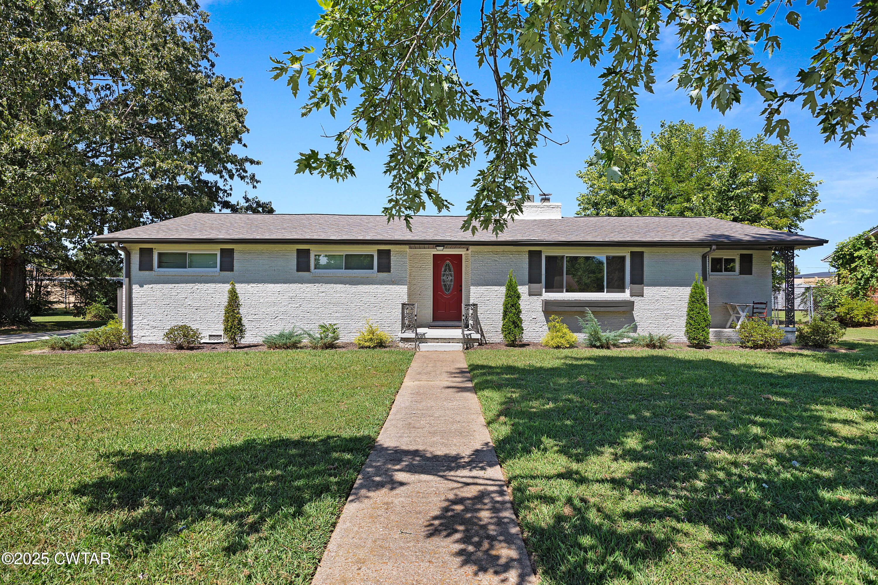 front view of a house with a yard