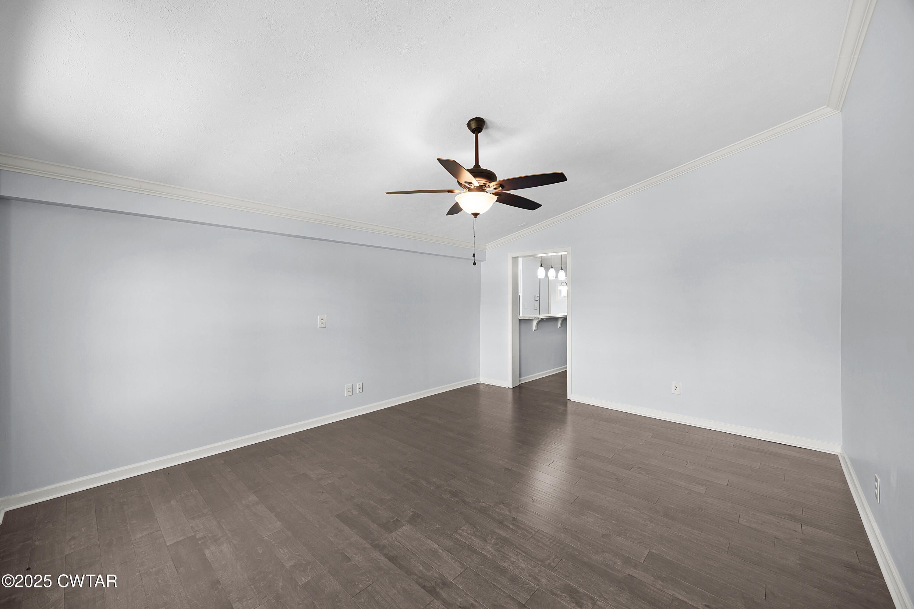 105 Dixie Lane Jackson, TN 38301 - Photo 14 of 25 a view of a room with wooden floor and ceiling fan