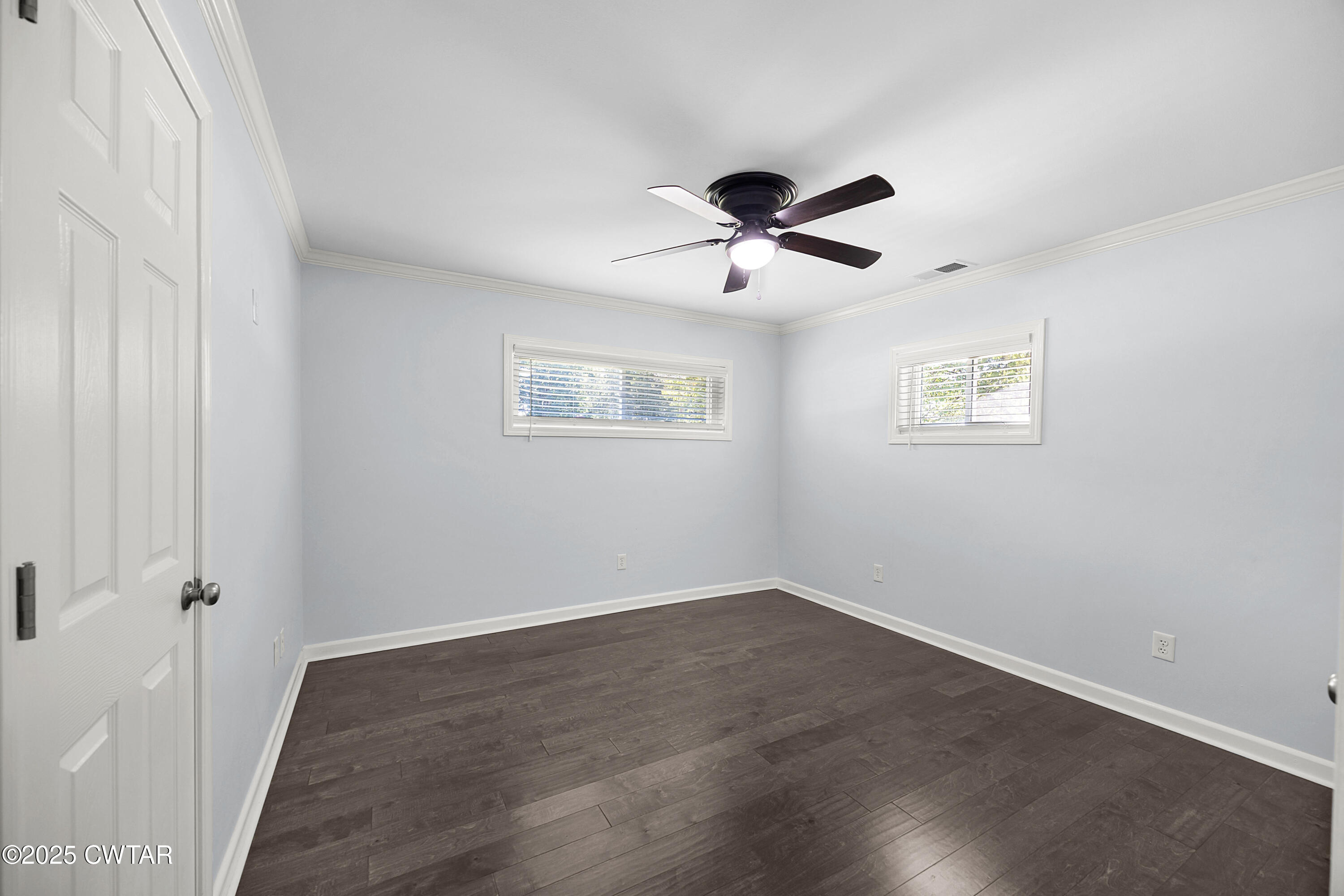 105 Dixie Lane Jackson, TN 38301 - Photo 15 of 25 a view of a big room with wooden floor and chandelier fan