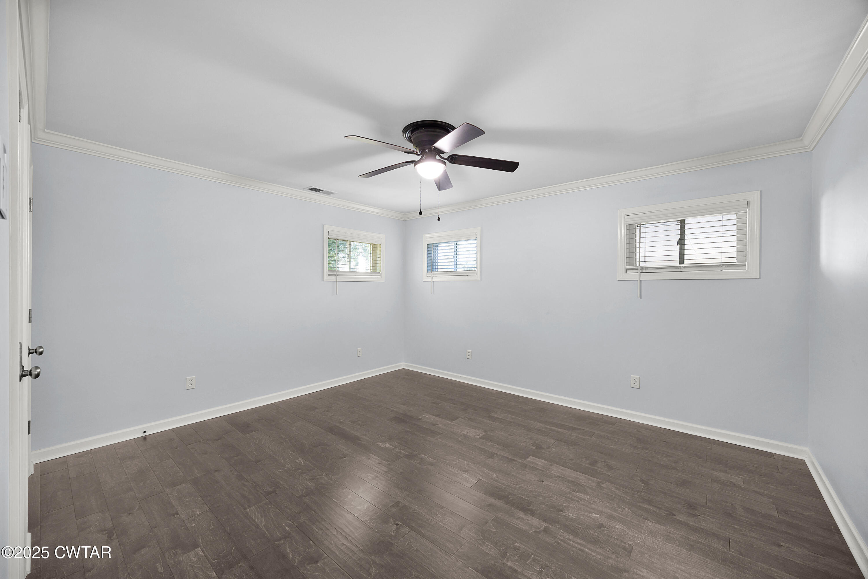 105 Dixie Lane Jackson, TN 38301 - Photo 18 of 25 wooden floor in an empty room with a window