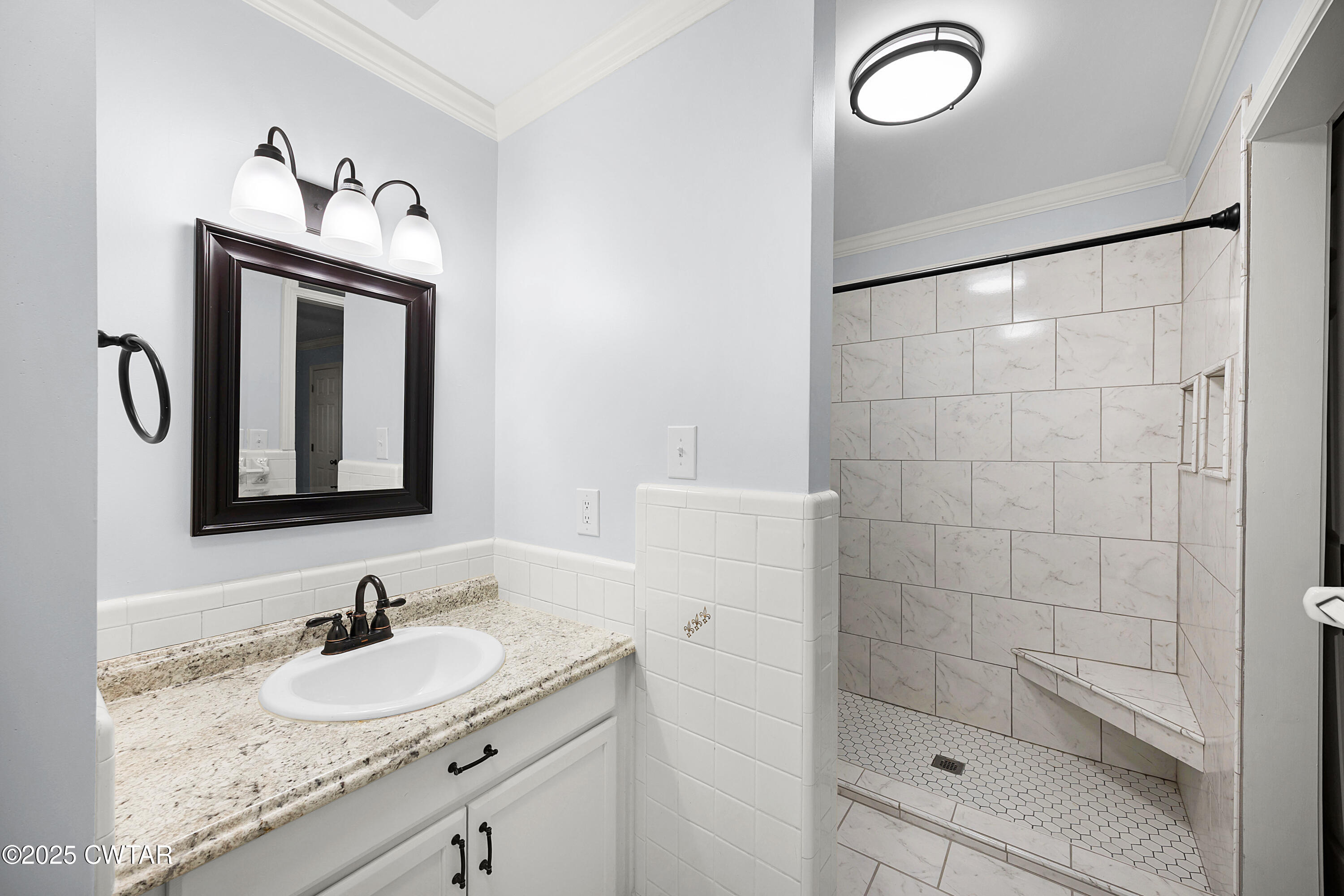 105 Dixie Lane Jackson, TN 38301 - Photo 20 of 25 a bathroom with a sink and a mirror