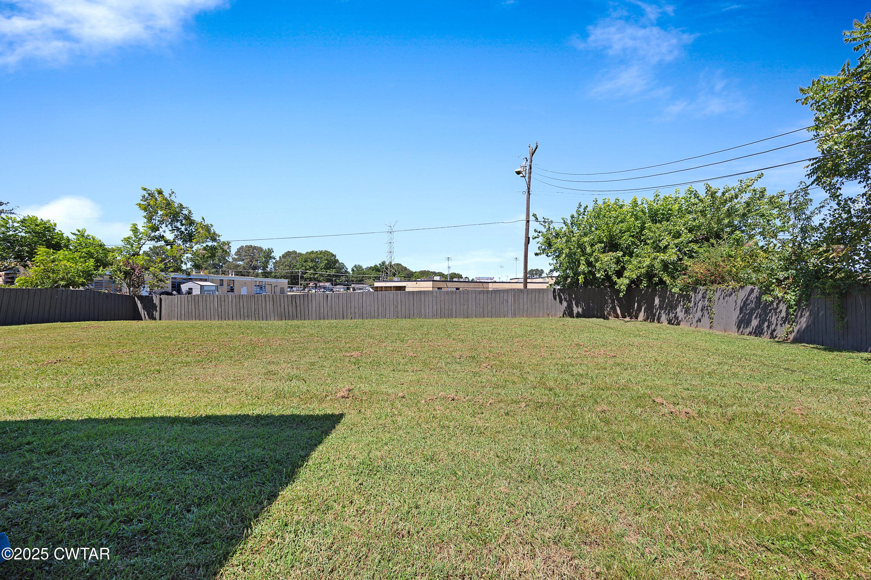 105 Dixie Lane Jackson, TN 38301 - Photo 21 of 25 a view of a lake with a big yard