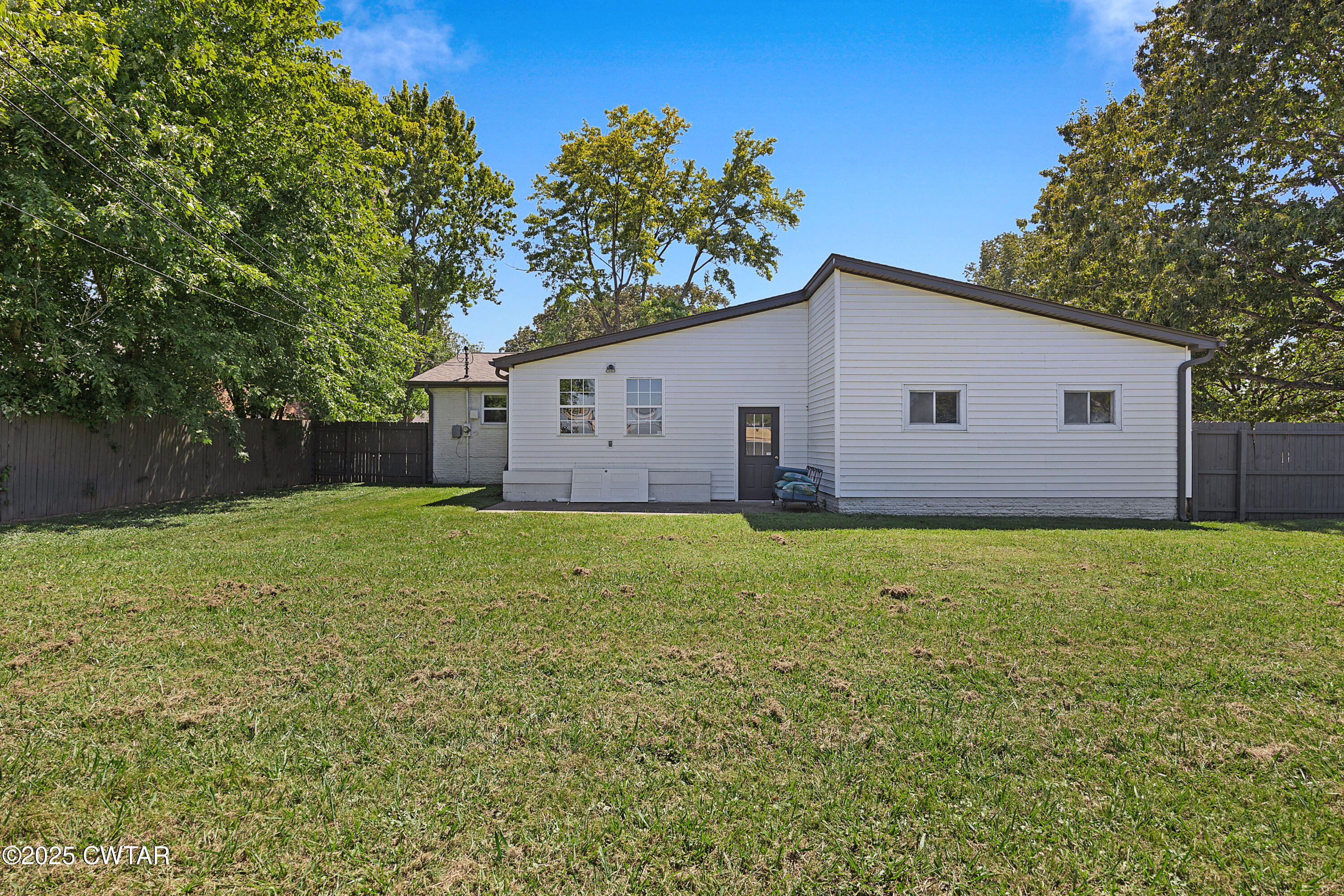 105 Dixie Lane Jackson, TN 38301 - Photo 22 of 25 a view of a house with a backyard