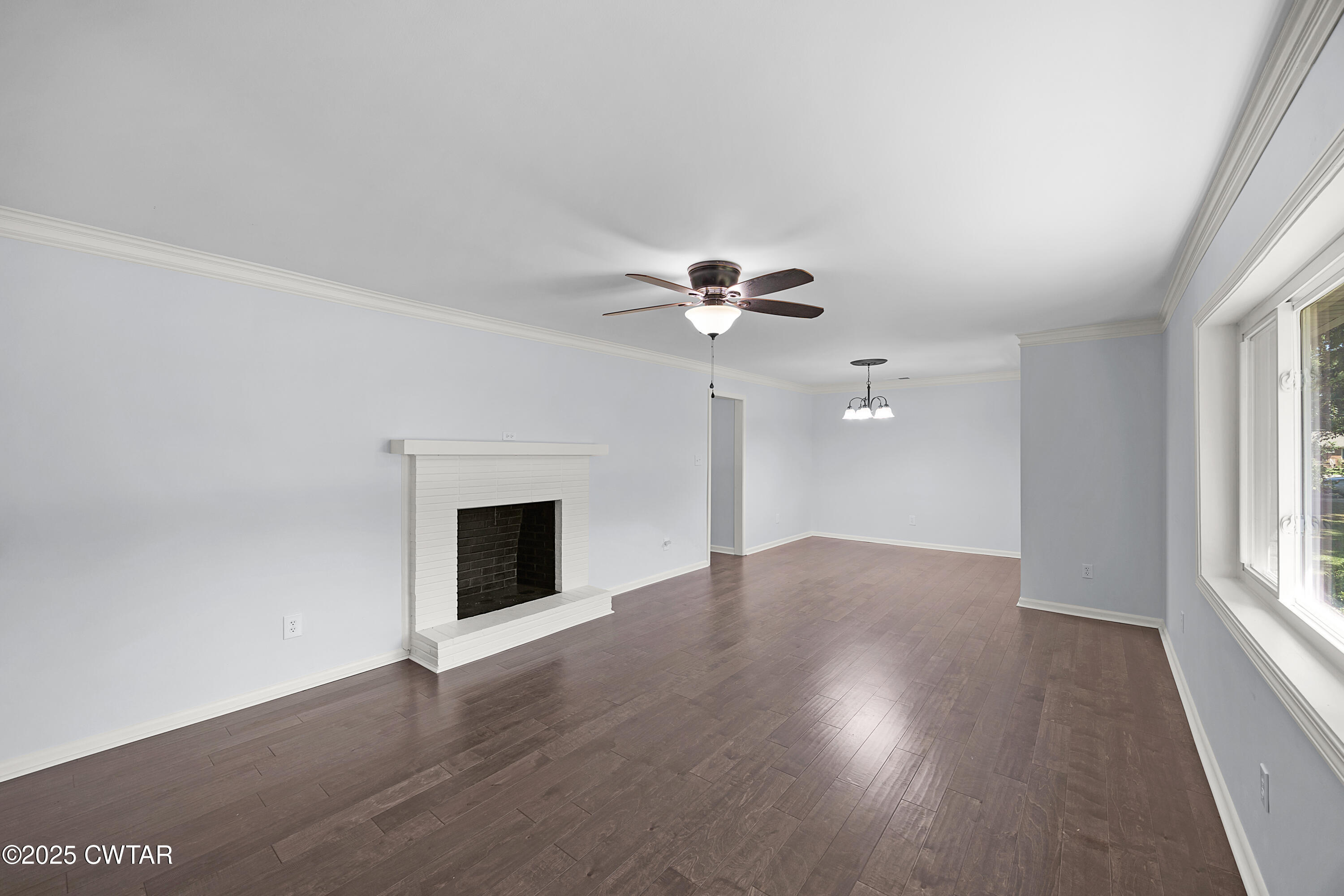 105 Dixie Lane Jackson, TN 38301 - Photo 4 of 25 wooden floor in an empty room with a window