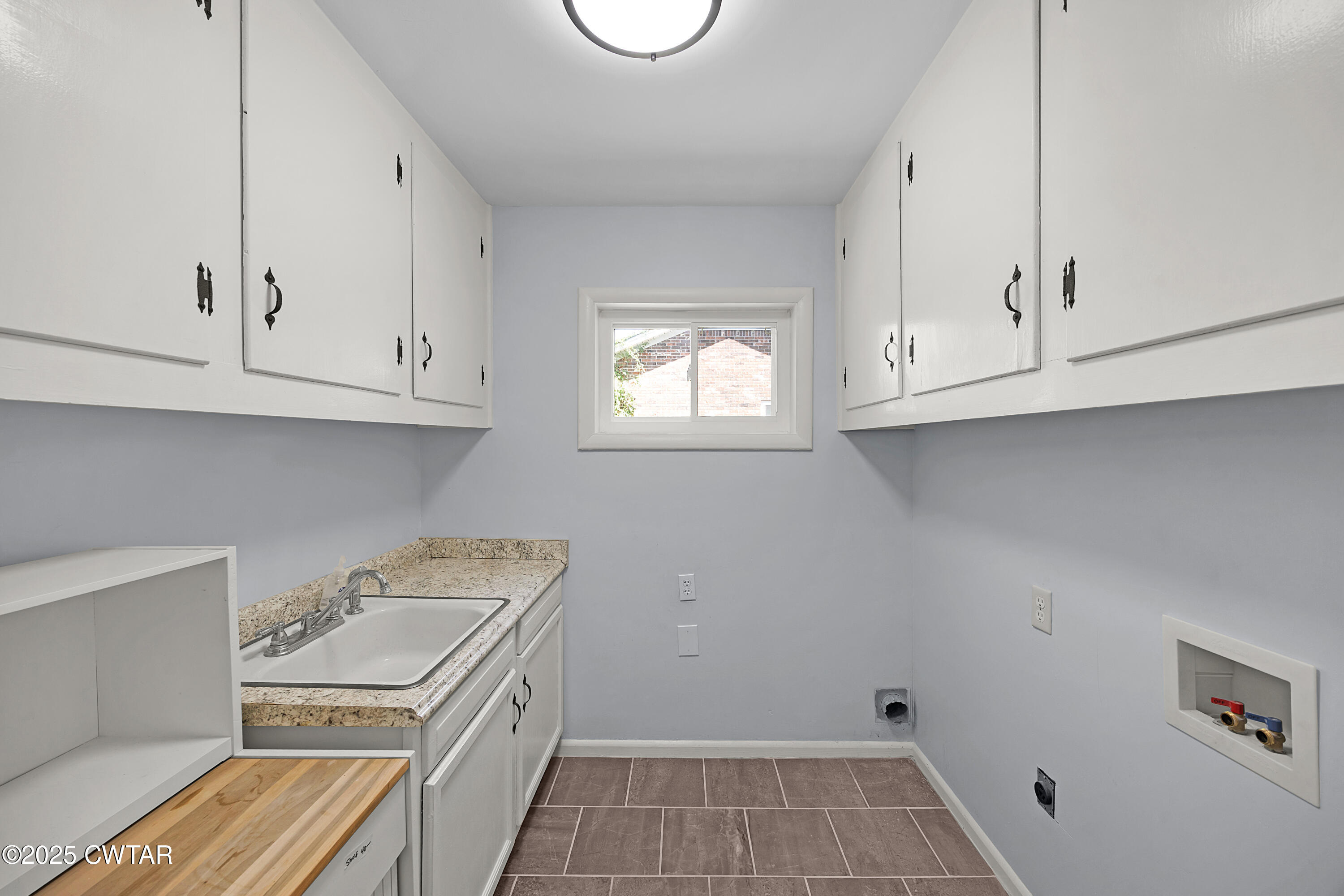 105 Dixie Lane Jackson, TN 38301 - Photo 6 of 25 a kitchen with white cabinets and a stove