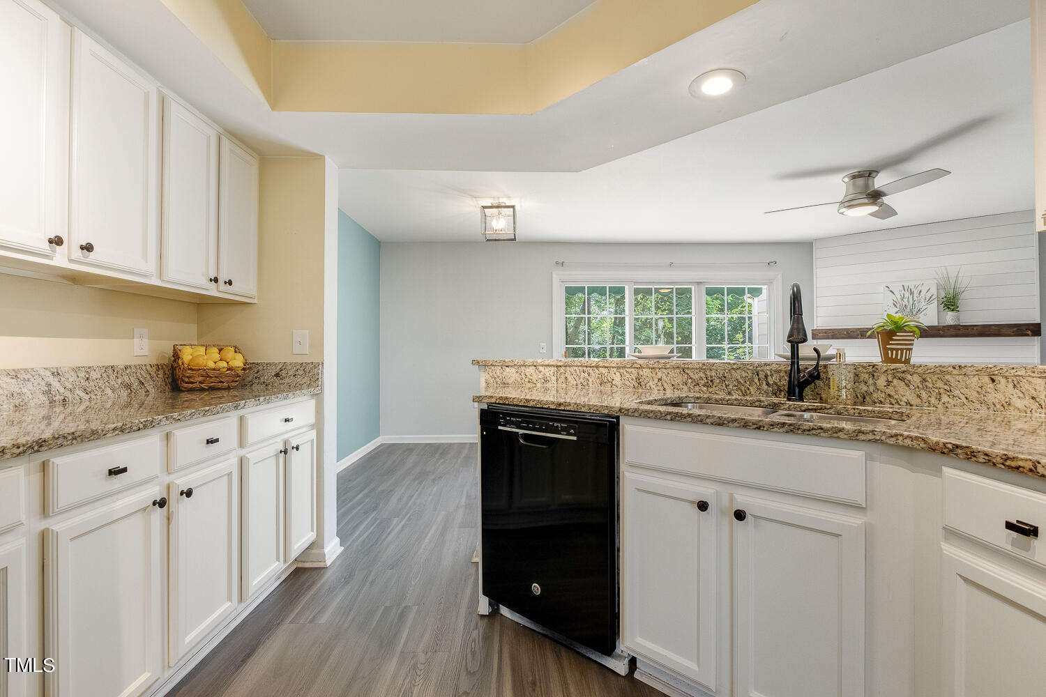 7747 Falcon Rest Circle Raleigh, NC 27615 - Photo 17 of 36 a kitchen with granite countertop a sink and cabinets