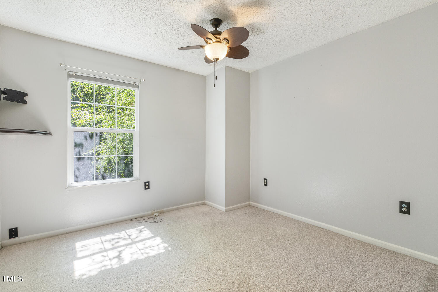 7747 Falcon Rest Circle Raleigh, NC 27615 - Photo 30 of 36 a view of room with a ceiling fan and window