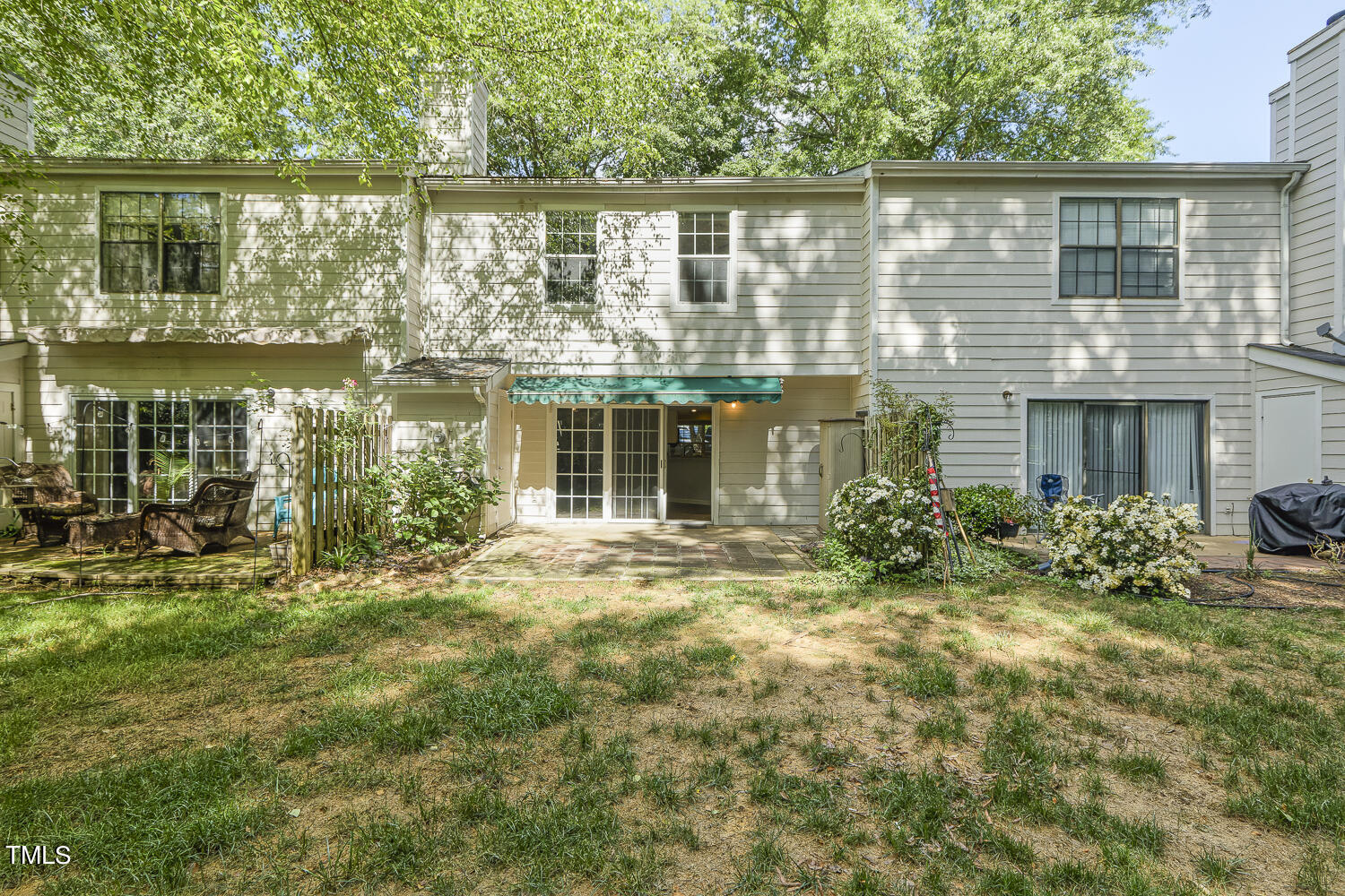 7747 Falcon Rest Circle Raleigh, NC 27615 - Photo 33 of 36 a front view of a house with a yard and balcony