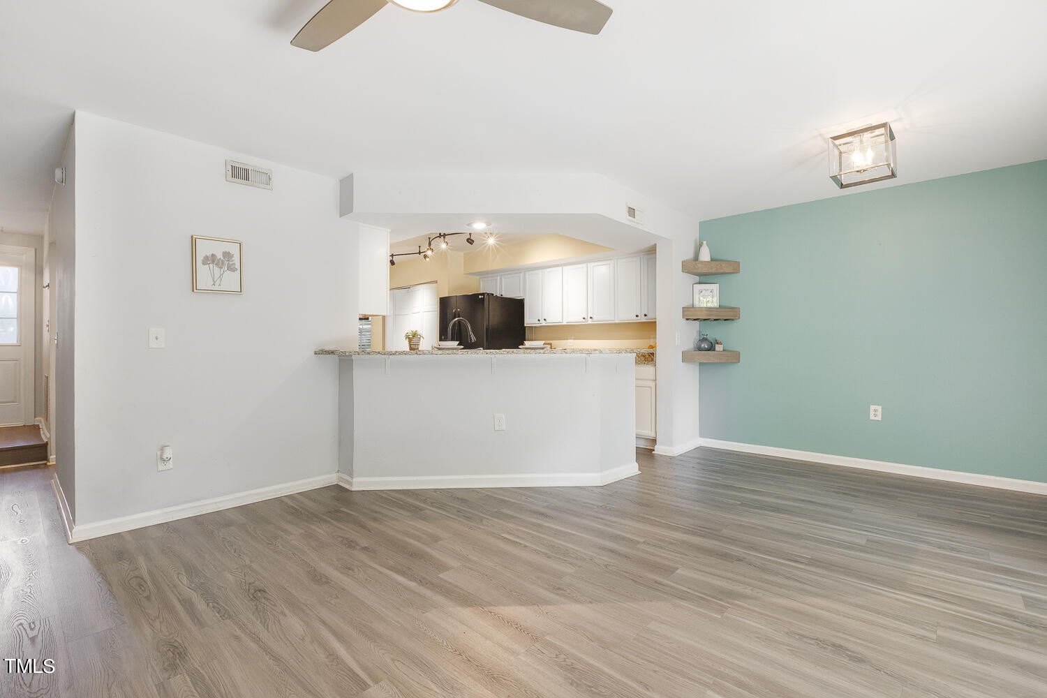 7747 Falcon Rest Circle Raleigh, NC 27615 - Photo 10 of 36 a view of a kitchen with wooden floor