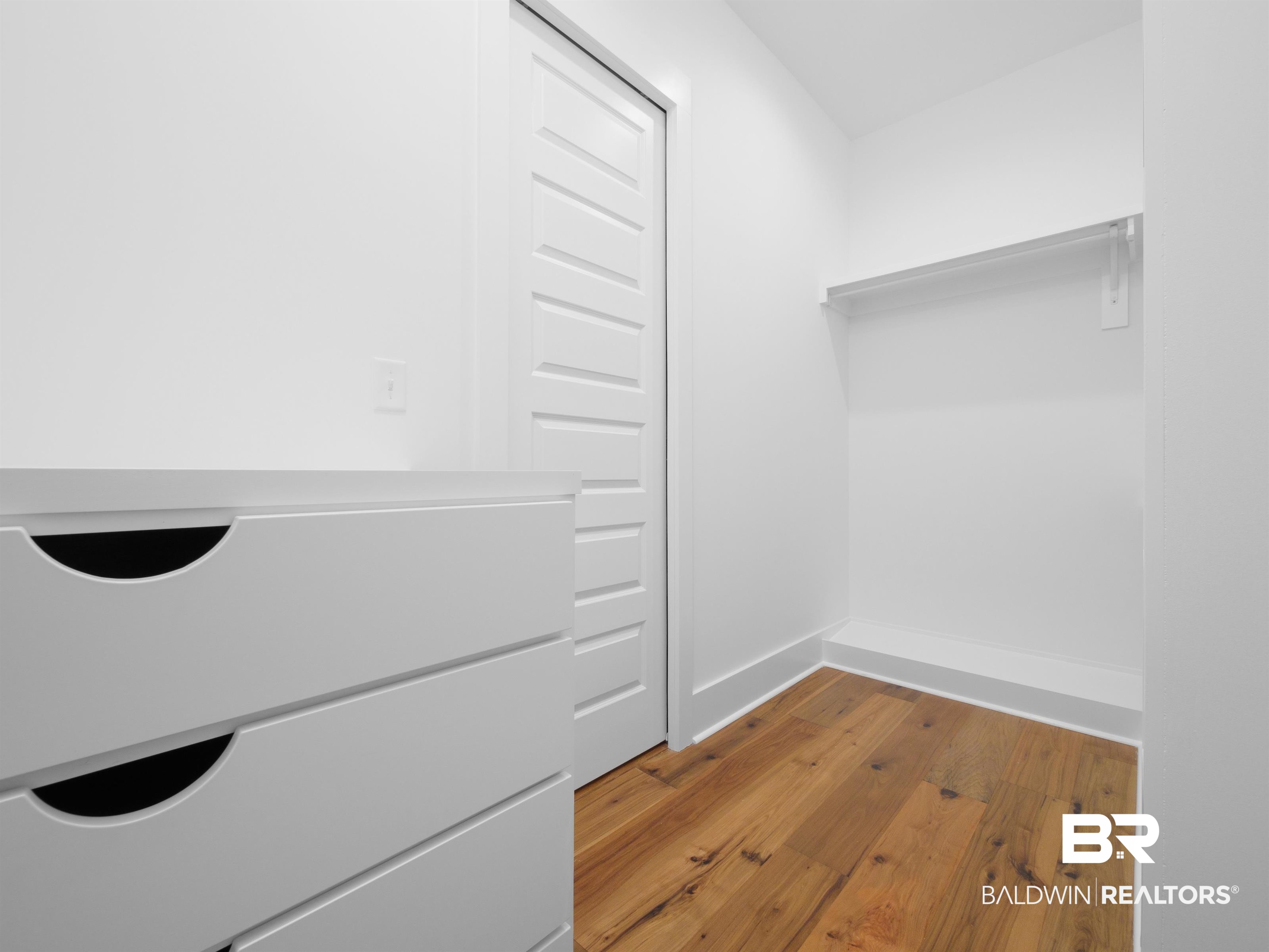 10970 Turin Avenue Fairhope, AL 36532 - Photo 14 of 61 Hardwood flooring, built in dresser and custom shelving