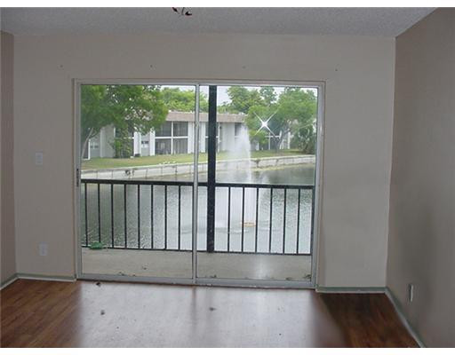 7901 South Colony Circle, Unit 203 Tamarac, FL 33321 - Photo 6 of 10 Living Room