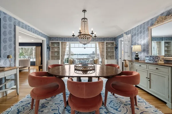 a view of a dining room with furniture window and wooden floor