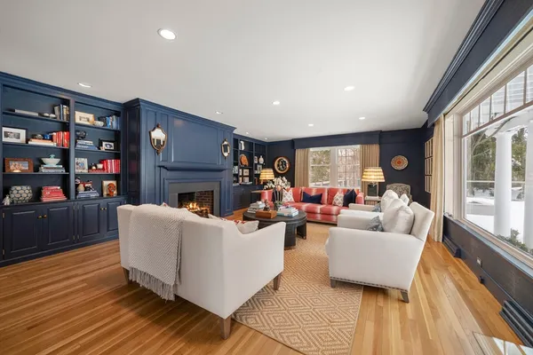a living room with furniture and a fireplace