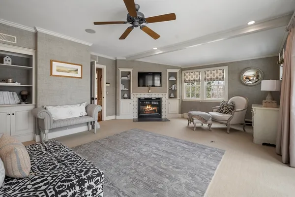 a living room with furniture and a fireplace
