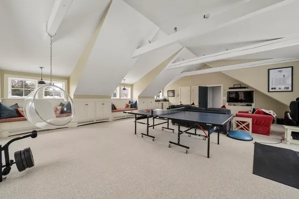 a living room with furniture and a table