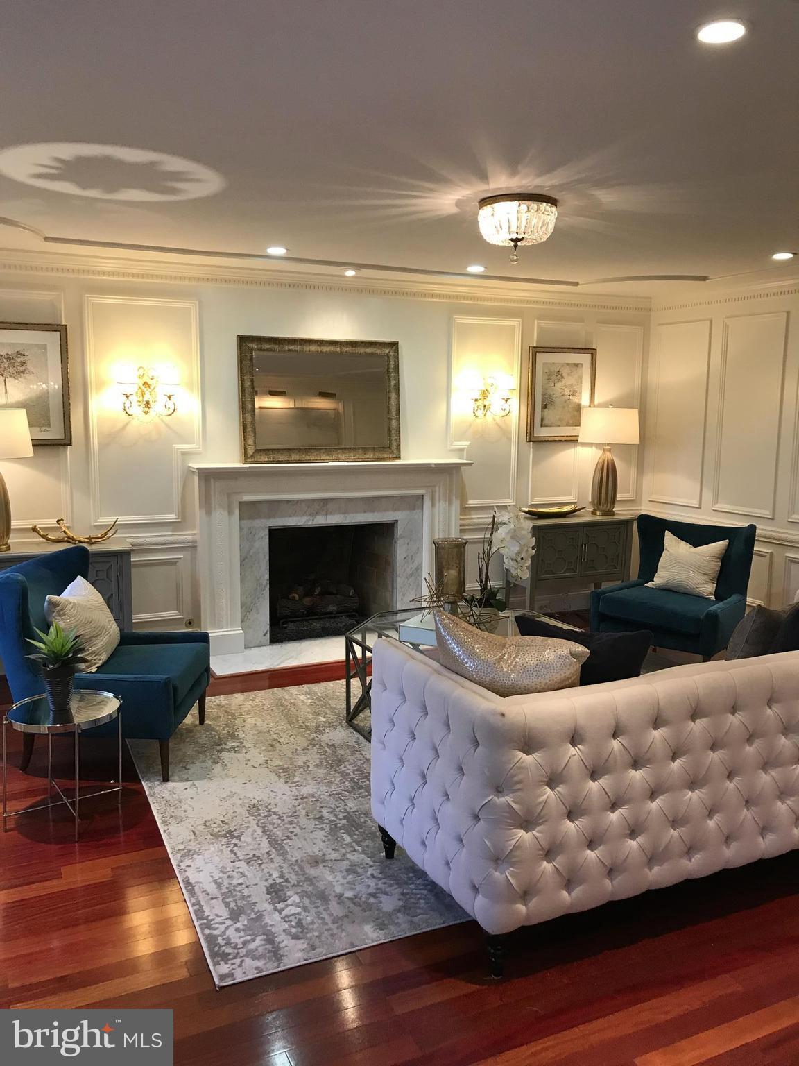 312 Runner Road Great Falls, VA 22066 - Photo 3 of 30 Living Room with Millwork and Fireplace