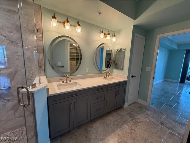 a white toilet sitting next to a shower