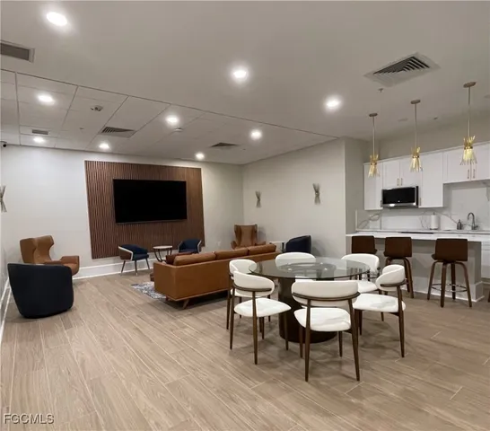 a view of swimming pool with a table and chairs