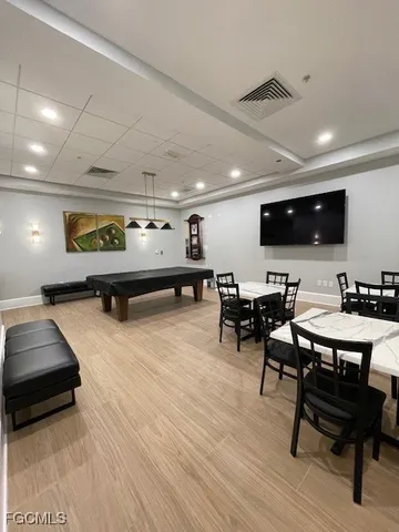 a large white kitchen with a large window