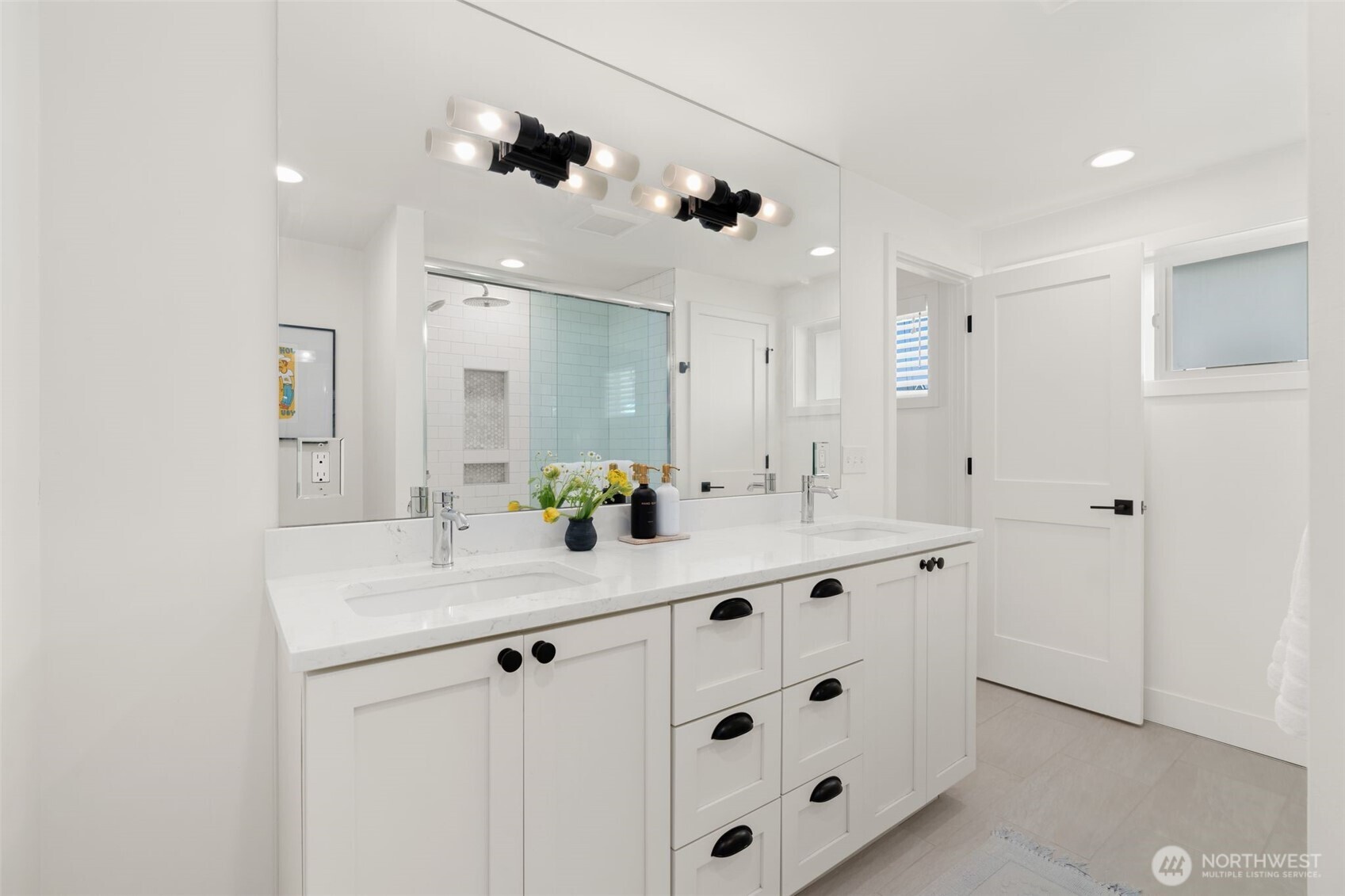 4129 19th Avenue Southwest Seattle, WA 98106 - Photo 22 of 34 a bathroom with a sink a vanity and mirror