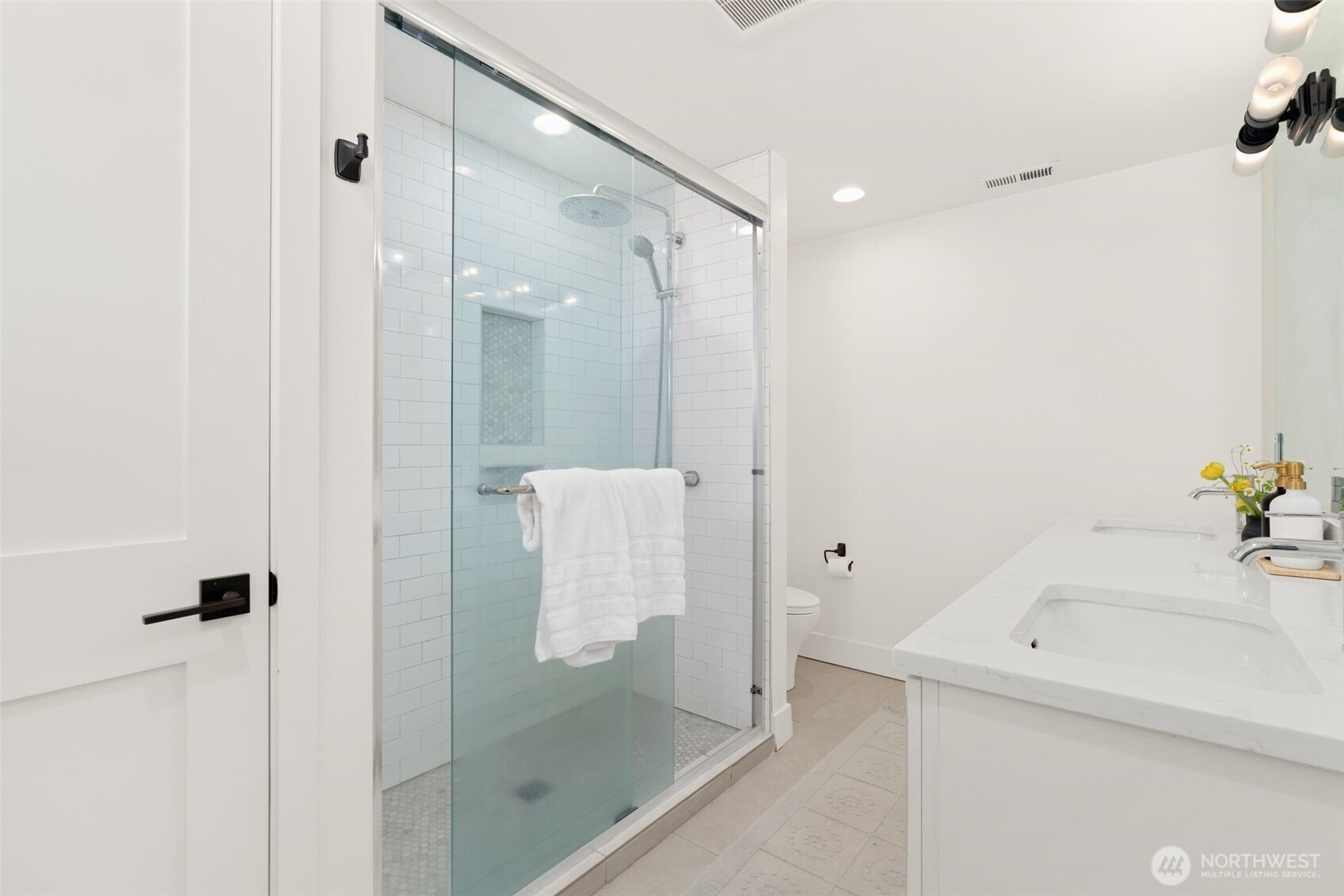4129 19th Avenue Southwest Seattle, WA 98106 - Photo 23 of 34 a bathroom with a shower and mirror
