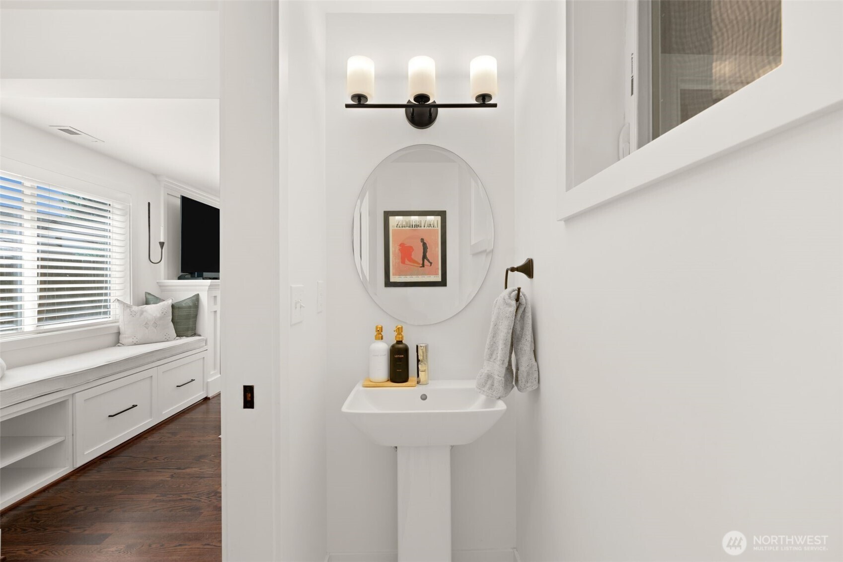 4129 19th Avenue Southwest Seattle, WA 98106 - Photo 24 of 34 a bathroom with a sink and a mirror