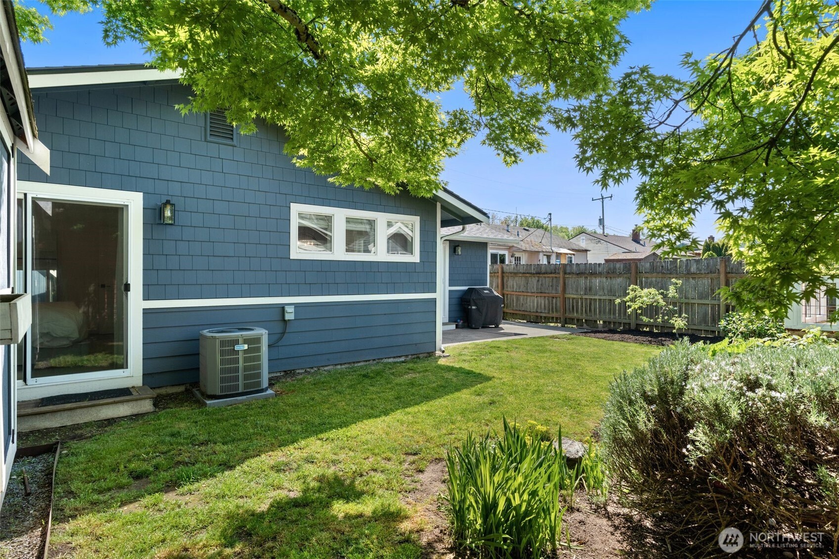 4129 19th Avenue Southwest Seattle, WA 98106 - Photo 29 of 34 a view of a house with a back yard