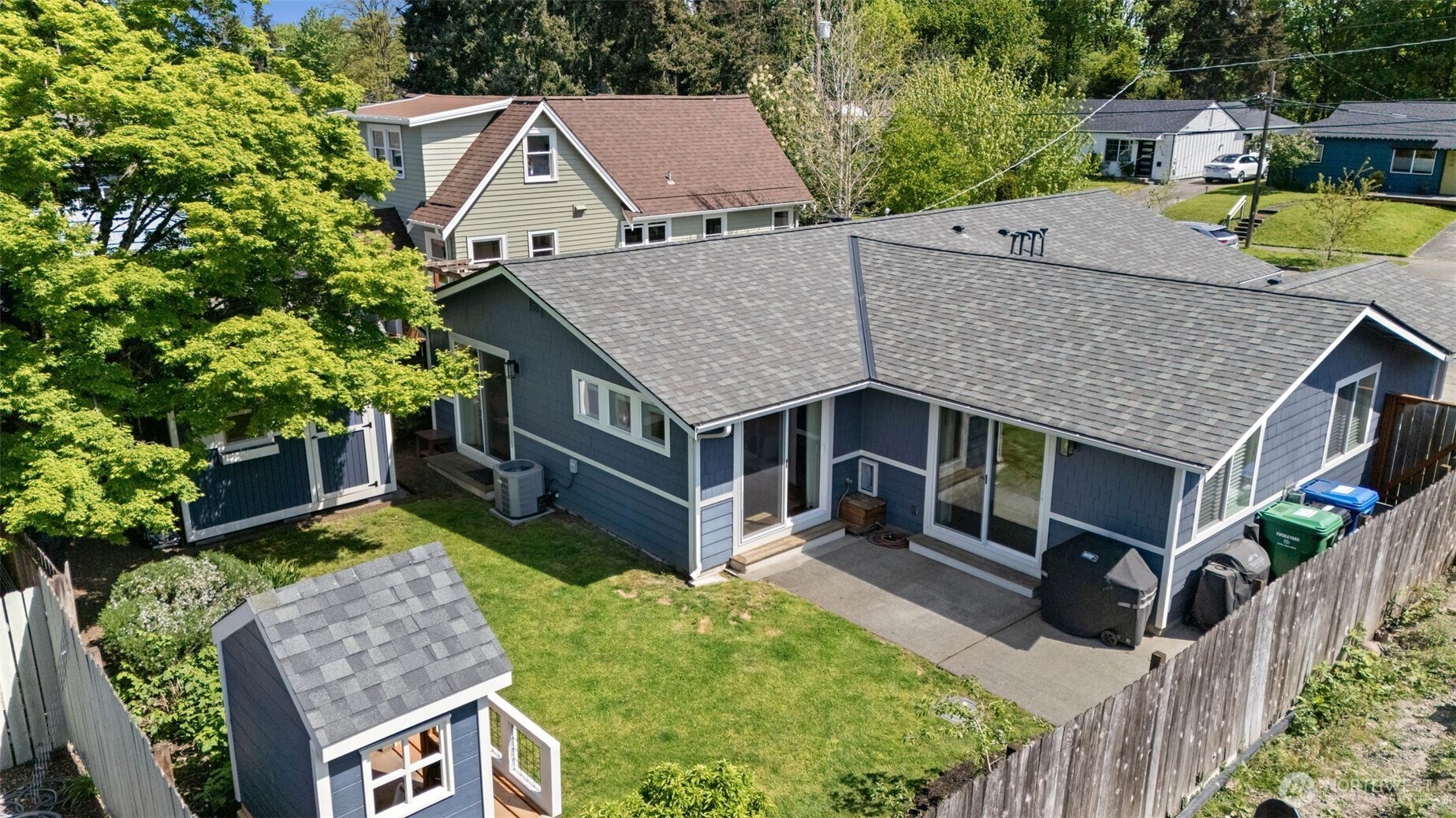 4129 19th Avenue Southwest Seattle, WA 98106 - Photo 31 of 34 an aerial view of a house with swimming pool and glass windows