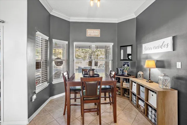 a view of a dining room with furniture window and outside view